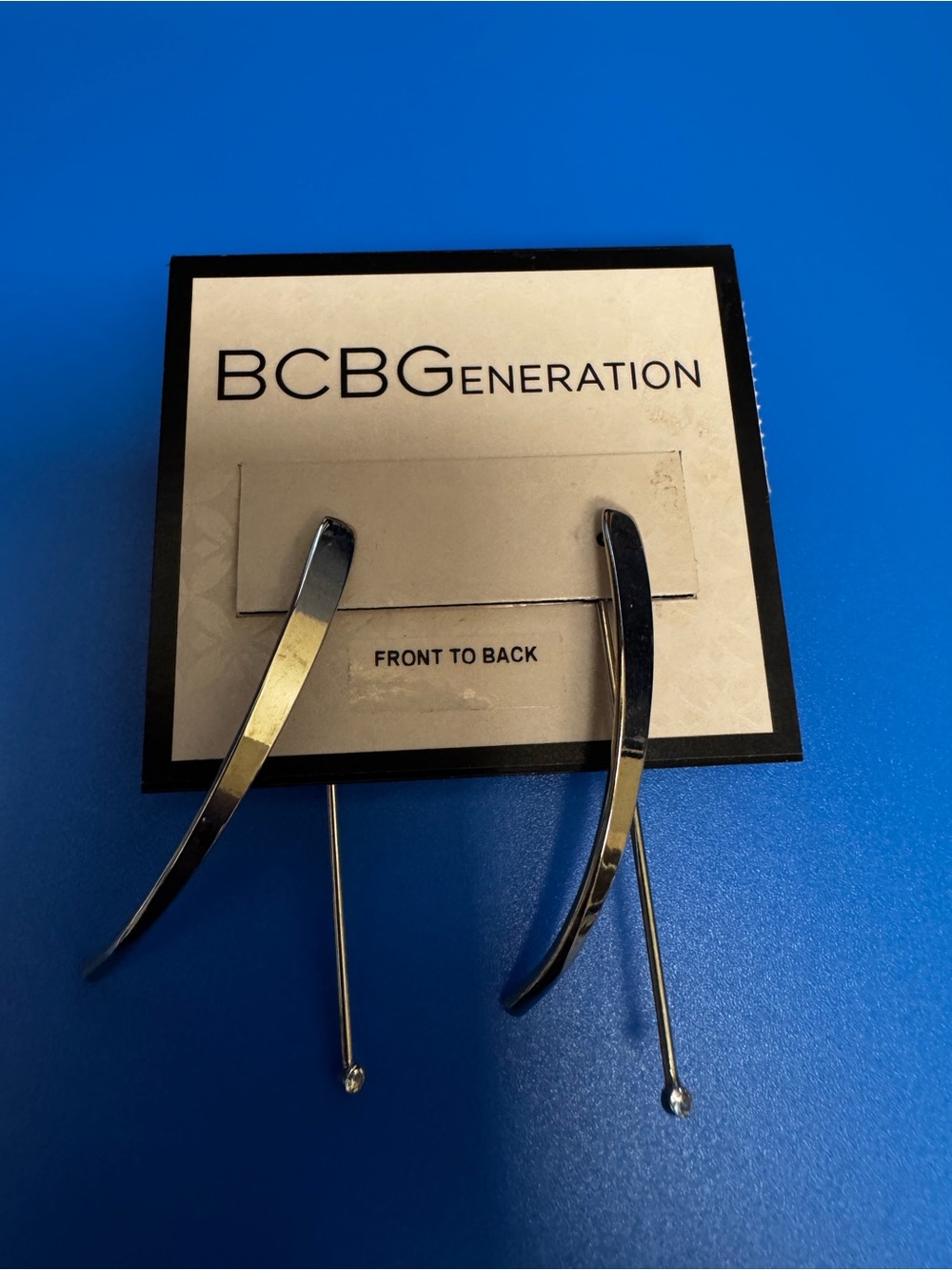 BCBGeneration  Sleek Curved Silver Stick Earrings front to back